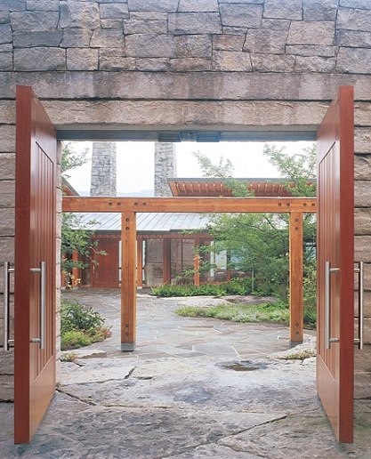 rustic home with modern doors