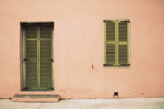 Peach wall green door